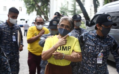 <p><strong>TERROR FINANCER</strong>. Leonor Taguinod Dumlao (in front, in yellow shirts) and a co-accused during a hearing at the Department of Justice (DOJ) last year. The DOJ on Wednesday (March 27, 2024) said Dumlao and Valentin Cruz Tolentino will be charged for violation of Section 8 of R.A. No. 10168, known as "The Terrorism Financing Prevention and Suppression Act of 2012." <em>(PNA photo by Ben Pulta)</em></p>