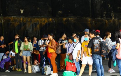 <p><strong>EARLY BIRDS.</strong> Province-bound passengers wait at a bus terminal in Cubao, Quezon City on Holy Wednesday (March 27, 2024). Senator Sonny Angara reminded students that the 20 percent student fare discount applies even during weekends and holidays. <em>(PNA photo by Joan Bondoc)</em></p>