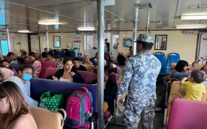 <p><strong>ON ALERT. </strong>A Philippine Coast Guard troop checks passengers at the Balingoan Port in Misamis Oriental province on Wednesday (March 27, 2024). The PCG is working with the Philippine National Police (PNP) and the Philippine Ports Authority (PPA) to address the expected influx of passengers in maritime gateways for the Holy Week<em>. (Photo courtesy of PCG)</em></p>