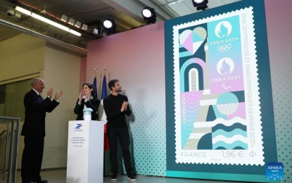 <p><strong>PARIS OLYMPIC STAMP</strong>. Chief Executive Officer of La Poste Group Philippe Wahl (from left), French Sports Minister Amelie Oudea-Castera, and President of the Paris 2024 Organizing Committee Tony Estanguet unveil the official stamp for the Paris 2024 Olympic and Paralympic Games during a presentation at the French Postal Museum in Paris, France, March 26, 2024. Drawing inspiration from the visual identity of the Paris Olympics, the stamp highlights iconic places like the Eiffel Tower and the River Seine, with sporting elements of athletics tracks and ball bounces featured in it. The stamp has exceptional finishes with hot stamping.<em> (Xinhua/Gao Jing)</em></p>