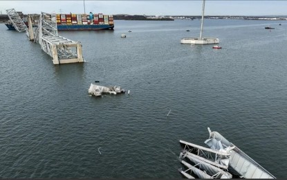 <p>An aerial view of the collapsed Francis Scott Key Bridge after a collision with a cargo ship in Baltimore, Maryland, United States on March 26, 2024.</p>