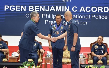 <p><strong>STAY COMMITTED.</strong> PNP chief Gen. Benjamin Acorda Jr. presides over the turnover rites for newly-revamped police officials in Camp Crame, Quezon City on Wednesday (March 27, 2024). Six police officers were included in the latest reshuffle in the police force. <em>(Photo courtesy of PNP)</em></p>