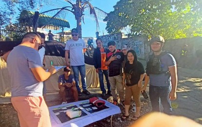 <p><strong>BLACK SATURDAY CATCH</strong>. The police conduct onsite inventory of illegal drugs seized from a 20-year-old construction worker (seated) during a buy-bust in Lapu-Lapu City, Cebu province on Saturday (March 31, 2024). He yielded 1.1 kilos of suspected shabu with a street value of PHP7.48 million. <em>(Photo contributed by Jonalyn Jumabis)</em></p>