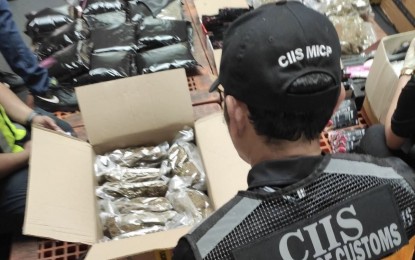 <p><strong>BUSTED.</strong> Customs officers account for kush and marijuana-laced vapes found in balikbayan boxes from Thailand during an inspection at the Manila International Container Port on Tuesday (April 2, 2024). The contraband worth PHP102 million was found in five balikbayan boxes. <em>(Photo courtesy of  CIIS-MICP)</em></p>