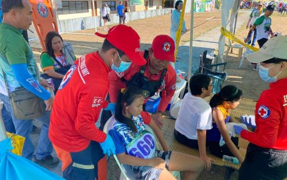 <p><strong>FIRST AID</strong>. Volunteers of the Philippine Red Cross (PRC) tend to athletes needing assistance at the first aid station in Panaad Park and Stadium in Bacolod City on Tuesday (April 2, 2024). The Panaad facilities are among the venues of the ongoing Negros Occidental Provincial Meet. <em>(Photo courtesy of PRC-Negros Occidental-Bacolod City Chapter)</em></p>