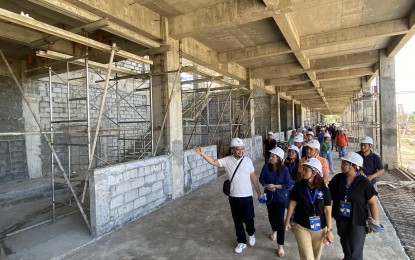 <p><strong>MONITORING.</strong> Members of the Regional Development Council (RDC) check the progress of Tacloban Airport terminal building construction in this Feb. 20, 2024 photo. At least 25 key projects in Eastern Visayas have been identified for monitoring by the RDC.<em> (Photo courtesy of RDC Eastern Visayas)</em></p>