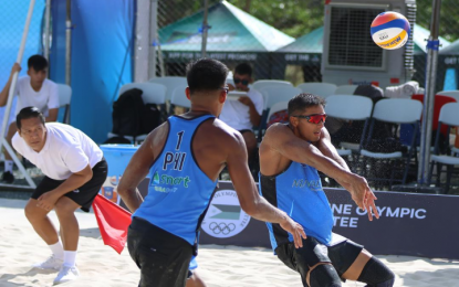 <p><strong>HOT START.</strong> AJ Pareja sets a return for teammate Ran Abadilla (1) in the opening of the Smart Asian Volleyball Confederation (AVC) Beach Tour Nuvali Open in Santa Rosa, Laguna on Thursday (April 4, 2024). The pair got off to a hot start after beating Australia’s Potts D’Artagnan and Ben Hood, 21-17, 21-19.<em> (PNVF photo)</em></p>