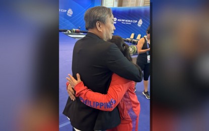 <p><strong>ALWAYS GOLDEN. </strong>Philippine Olympic Committee president Abraham Tolentino consoles Hidilyn Diaz after her stint in the International Weightlifting Federation World Cup in Phuket, Thailand on Wednesday (April 3, 2024). Diaz placed 11th in the women's 59 kg category of the final qualifying event for the Paris Olympics, missing out on a fifth consecutive Summer Games stint. <em>(Contributed photo) </em></p>