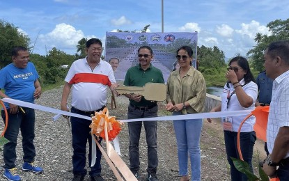 <p><strong>FLOOD PROTECTION</strong>. Agusan del Norte 2nd District Rep. Dale Corvera (center), together with Agusan del Norte Vice Gov. Enrico Corvera (2nd from left), leads the ribbon-cutting that marked the opening and turnover of the newly-completed PHP29-million flood control project on Thursday (April 4, 2024) to residents of Barangay Crossing, Kitcharao town. The project enhances the villagers' resilience to natural disasters and helps protect their livelihoods and properties. <em>(Photo courtesy of Cong. Dale Corvera)</em></p>