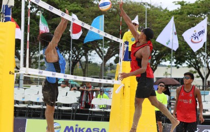 <p><strong>TOUGH MATCH. </strong>The Philippines' Rancel Varga tries to score while James Buytrago looks on during the match against Japan’s Kosuke Fukishima and Hiroki Dylan Kurokawa in the preliminary round of the Smart Asian Volleyball Confederation (AVC) Beach Tour Nuvali Open at the Nuvali Sand Courts by Ayala Land in Sta. Rosa, Laguna on Friday (April 5, 2024). The Filipinos lost, 22-20, 26-28, 13-15. <em>(PNVF photo) </em></p>