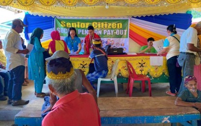 <p><strong>SOCIAL PENSION.</strong> Senior citizens sign documents upon receiving the cash aid from the social pension fund in Pikit, North Cotabato on Friday (April 5, 2024). At least 8,898 senior citizens in the town are set to receive PHP6,000 each from an allocated fund of PHP53.3 million, in scheduled payouts until April 10. <em>(Photo courtesy of North Cotabato PIO)</em></p>