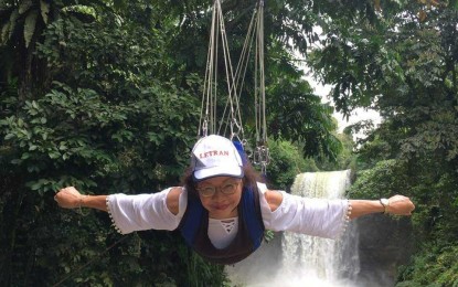 <p><strong>WANDERLUST.</strong> No adventure is too daring for Emerita Parayno, 68, as she defies gravity on the famed Lake Sebu Seven Falls zipline in the province of South Cotabato in Mindanao. A confessed nature lover, the sprightly grandmother said travel is good for seniors as it widens horizons and benefits their health. <em>(Photo courtesy of Emerita Parayno)</em></p>