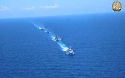 <p><strong>QUAD GOALS.</strong> BRP Antonio Luna leads three other ships in a column formation during the division tactics/officer of the watch maneuver exercise at the first Multilateral Maritime Cooperative Activity in the West Philippine Sea on Sunday (April 7, 2024). The United States, Japan and Australia sent their assets in a united stand to strengthen regional and international cooperation for a free and open Indo-Pacific. <em>(Photo courtesy of AFP)</em></p>