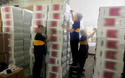 <p><strong>ILLICIT CIGARETTES.</strong> Bureau of Internal Revenue (BIR) personnel account for the confiscated cigarette machines, sacks of raw tobacco, and fake internal revenue stamps during a raid in one of three warehouses in Cavite on March 21, 2024. BIR Commissioner Romeo Lumagui Jr. said Thursday (June 20, 2024) that the combined estimated total tax liability from raids conducted this year amounts to PHP7.2 billion. <em>(Photo from BIR)</em></p>
