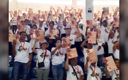 <p><strong>LAND TITLES</strong>. Some of the recipients of new land titles from the Department of Agrarian Reform in Negros Occidental at Manuel Y. Torres Memorial Coliseum and Cultural Center in Bago City on Monday (April 8, 2024). The distribution rites were led by President Ferdinand R. Marcos Jr. and DAR Secretary Conrado Estrella III. <em>(PNA photo by Nanette L. Guadalquiver)</em></p>