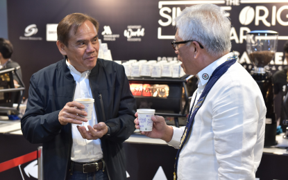 <p><strong>FOOD TOURISM</strong>. Batangas Provincial Administrator Wilfredo Racelis (right) and Rod Bautista, head of the Office of the Provincial Agriculturist, share insights on preserving the Kapeng Barako heritage at the Manila Coffee Festival 2024 on March 15, 2024. The Provincial Tourism and Cultural Affairs Office (PTCAO) is highlighting “gotong Batangas” and “kapeng barako” as part of the celebration of Filipino Food Month or Buwan ng Kalutong Filipino this April. <em>(Photo courtesy of PTCAO)</em></p>