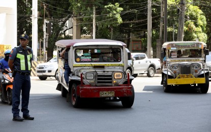 <p><strong>EASED OUT.</strong> Traditional jeepneys ply Kalaw Street in Manila on April 11, 2024. Senators on Friday (June 21) said jeepney drivers and local manufacturers must benefit from the Public Transport Modernization Program. <em>(PNA photo by Yancy Lim)</em></p>