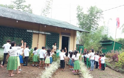 <p><strong>ACCESS TO EDUCATION</strong>. Learners of the Busog Primary School during their flag-raising ceremony in an undated photo. Dr. Daryl Arguelles, principal-in-charge of the District of Bugasong and Valderrama, said in an interview Thursday (April 11, 2024) that Busog is one of the primary schools in Valderrama converted by the Department of Education into an elementary school. (<em>Photo courtesy of DepEd District of Bugasong and Valderrama</em>)</p>