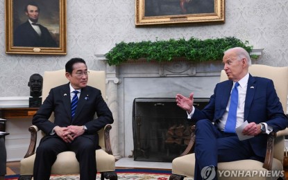 <p>US President Joe Biden (R) meets with Japanese Prime Minister Fumio Kishida in the Oval Office of the White House in Washington on April 10, 2024, in this photo released by AFP. <em>(Yonhap)</em></p>