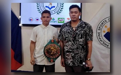 <p><strong>PSA ACHIEVER. </strong>World Boxing Council mini-flyweight champion Melvin Jerusalem (left) with Sanman Promotions CEO JC Mananquil during the Philippine Sportswriters Association (PSA) Forum at the Rizal Memorial Sports Complex on April 2, 2024. Jerusalem led the PSA Monthly Achievers for March. <em>(Contributed photo) </em></p>