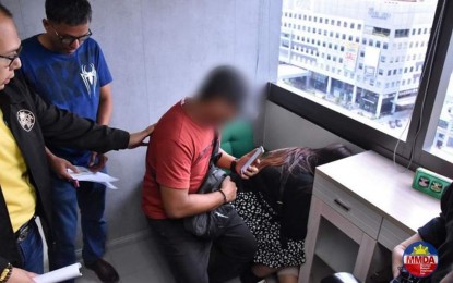 <p><strong>NO SACRED COWS.</strong> Authorities arrest suspects Jaz Abalos and Antonio Mirasol in an entrapment at the MMDA main office in Pasig City on Thursday (April 11, 2024). Jaz reportedly claimed to be a niece of DILG Secretary Benjamin Abalos Jr. to avoid apprehension and tried to negotiate with authorities over the van she operated, which was apprehended for having an expired registration. <em>(Photo courtesy of MMDA)</em></p>