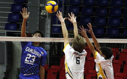 <p><strong>TRIUMPH. </strong>Canossa Academy of Lipa's Jacob Adoremos (No. 23) tries to score against Golden Whiskers Club defenders in the 2024 Philippine National Volleyball Federation (PNVF) Under-18 Championship at the Rizal Memorial Sports Complex on Friday (April 12, 2024). Canossa Academy won, 25-10, 25-18. <em>(Contributed photo)</em></p>