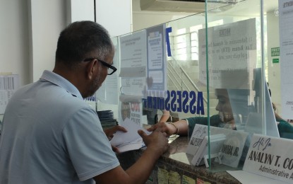 <p><strong>OVERTIME. </strong>An employee of the Land Transportation Franchising and Regulatory Board-Central Visayas in Cebu City processes consolidated franchise documents in this undated photo. The agency expects a surge in applicants for the Public Utility Vehicle Modernization Program until the April 30, 2024 deadline, thus the extended work hours on two Saturdays (April 13 and 27). <em>(Photo courtesy of LTFRB-7)</em></p>