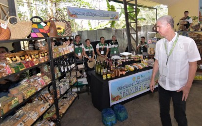 <p><strong>FOOD SECURITY FAIR</strong>. Negros Occidental Governor Eugenio Jose Lacson checks out the display at the trade fair of the Food Security Fair and Exhibit at Panaad Park and Stadium in Bacolod City on Monday (April 15, 2024). The event is part of the 28th Panaad Sa Negros Festival from April 15 to 21, 2024.<em> (Photo courtesy of PIO Negros Occidental)</em></p>