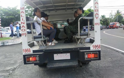 <p><strong>LIBRENG SAKAY</strong>. A police mobile patrol car in Malinao, Albay gives a free ride to commuters on Monday (April 15, 2024). At least 165 vehicles of the Police Regional Office in Bicol were deployed to help passengers affected by the nationwide transport strike.<em> (Photo courtesy of PRO5)</em></p>