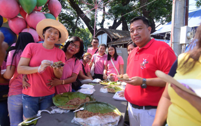 <p><strong>REVELRY</strong>. Asingan town Mayor Carlos Lopez Jr. (right) and Vice Mayor Heidee Chua (left, with hat) pose during the Kankanen Festival at the town plaza in Barangay Poblacion in Asingan town, Pangasinan on April 13,2024. The festival is a celebration of the bountiful harvest of its farm workers. <em>(Photo courtesy of Asingan PIO)</em></p>