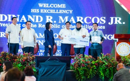 <p><strong>TOURISM CHAMPIONS CHALLENGE</strong>. Tourism Secretary Christina Frasco (3rd from left) and President Ferdinand R. Marcos Jr. award certificates and checks to mayors and representatives of local government units that won the Tourism Champions Challenge (TCC) on PICC in Pasay City on Monday (April 15, 2024). The Department of Tourism, through the TCC, invited cities and municipalities nationwide to propose tourism-related infrastructure projects to enrich local tourism destinations via sustainable, inclusive, and resilient tourism. <em>(Photo from PCO Facebook page)</em></p>