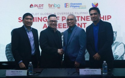 <p><strong>PARTNERSHIP.</strong> (From left) PLDT Global CFO Leo Posadas, PLDT Global president and CEO Albert Villa-Real, OFBank officer-in-charge Reo Andarino, and OFBank executive Leover Loyola during the signing of a partnership agreement between PLDT and OFBank on Tuesday (April 16, 2024). Through the partnership, overseas Filipinos will have access to secure online banking through the use of a Smart virtual number and the OFBank mobile app.<em> (Photo courtesy of PLDT)</em></p>