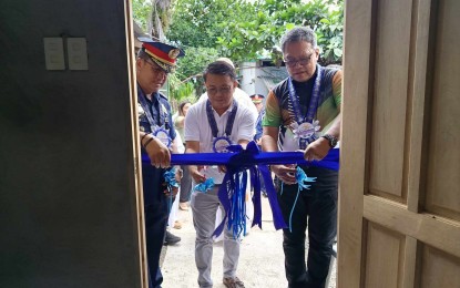 <p><strong>BLESSING.</strong> Philippine Drug Enforcement Agency-Bicol (PDEA) and Philippine National Police (PNP) officials attend the inauguration, blessing, and memorandum of agreement signing for a new Balay Silangan Reformation Center in Barangay Sta. Rosa del Norte, Pasacao, Camarines Sur on Tuesday (April 16, 2024). PDEA-Bicol recorded 87 Balay Silangan hubs already established in the six provinces of the region. <em>(Photo courtesy of PDEA-Bicol)</em></p>
