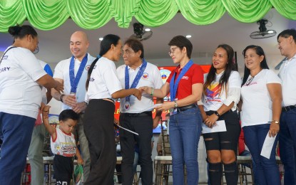 <p><strong>CRISIS ASSISTANCE.</strong> Presidential Assistant for the Visayas Terrence Calatrava (2nd from left), Congressman Edsel Galeos (4th from left), and DSWD 7 (Central Visayas) Director Shalaine Marie Lucero (5th from left) distribute the cash assistance to some of the 1,363 individuals in crisis during the Bagong Pilipinas Serbisyo Fair in Dalaguete, Cebu on Saturday (April 13, 2024). Lucero said on Tuesday (April 16, 2024) that they distributed PHP5.4 million worth of assistance during the service caravan of the national government. <em>(Photo courtesy of DSWD-7)</em></p>
<p> </p>