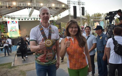 <p><strong>PANAAD FEST</strong>. Senator Imee Marcos (right) and Negros Occidental Governor Eugenio Jose Lacson flash the "Abanse Negrense" sign on the sidelines of the opening of the 28th Panaad Sa Negros Festival at the Panaad Park and Stadium in Bacolod City on Monday afternoon (April 15, 2024). Marcos said in her message that the theme of the festivity was “living the promise” of better and brighter days for the province of Negros Occidental, as Panaad is already an achievement. <em>(Photo courtesy of PIO Negros Occidental)</em></p>