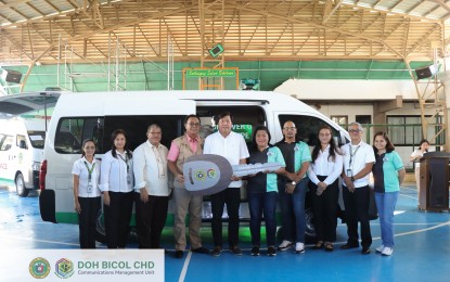 <p><strong>TURNOVER</strong>. Bato Mayor Juan T. Rodulfo (5th from left) receives the ceremonial key for a new land ambulance unit from officials of the Department of Health-Center for Health Development-Bicol (DOH-CHD-5) during the turnover ceremony at the regional DOH office in Legazpi City on April 15, 2024. DOH-5 distributed 14 fully equipped ambulance units costing PHP1.9 million each.<em> (Photo courtesy of DOH-Bicol)</em></p>