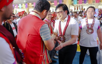 <p><strong>TOWARDS DEVELOPMENT.</strong> DILG Secretary Benjamin Abalos Jr. shakes hands with local officials during his visit to Sumisip, Basilan on April 14, 2024, for the celebration of the Kalasig-lasigan Festival. The DILG on Wednesday (April 17) said Abalos vowed to continue supporting the province's peace and development efforts. <em>(Photo courtesy of DILG)</em></p>