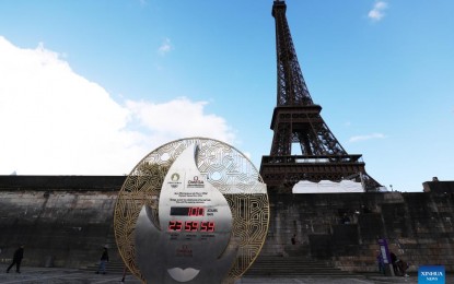 <p><strong>OLYMPIC COUNTDOWN.</strong> A countdown clock for the Paris 2024 Olympic Games stands in front of the Eiffel Tower in Paris, France in this photo taken on April 16, 2024. The Olympic Games will take place from July 26 to Aug. 11. <em>(Xinhua/Gao Jing)</em></p>