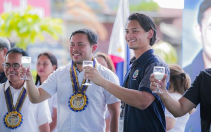 <p><strong>CARABAO DAIRY PROJECT.</strong> Senator Mark Villar (center), Mayor Javier Miguel Benitez (right) and Philippine Carabao Center Deputy Executive Director Caro Salces lead the milk toasting during the blessing and turnover of the Dairy Box in Victorias City, Negros Occidental on Thursday (April 18, 2024). The facility is a component of the PHP10-million Carabao-Based Business Improvement Network Project implemented by the Department of Agriculture - Philippine Carabao Center and funded by the Office of Senator Cynthia Villar. <em>(Photo courtesy of Victorias City Information Office)</em> </p>