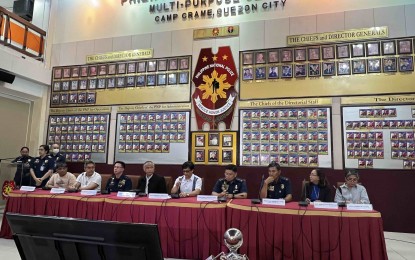 <p><strong>TRANSPARENCY OBSERVED.</strong> DILG Secretary Benjamin Abalos Jr. (middle, in polo barong) explains the updated figures of the seized illegal drugs in a recent operation in Batangas, in a press briefing in Camp Crame on Thursday (April 18, 2024). Earlier reports said the amount of seized illegal drugs was at PHP13.3 billion but an update from the Police Regional Office (PRO) Calabarzon showed the amount decreased to PHP9.6 billion. <em>(PNA photo by Lloyd Caliwan)</em></p>