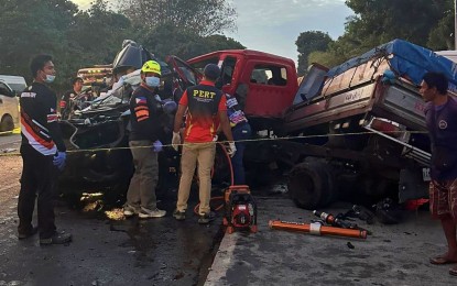 <p><strong>ROAD COLLISION.</strong> Rescue workers try to retrieve the remains of one of the passengers of a pickup vehicle who died during a Thursday dawn (April 18, 2024) three-vehicle pileup along the national highway in Tupi, South Cotabato. Two died on the spot, while three were critically injured. <em>(Photo courtesy of Tupi MDRRMO)</em></p>