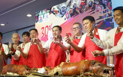 <p><strong>FOOD SECURITY.</strong> Senator Mark Villar (fifth from left) and Agriculture Secretary Francisco Tiu Laurel Jr. (sixth from left) partake of the roasted pork during the ceremonial lechon choppings at the opening of the 30th Hog Convention and Trade Exhibits on Thursday (April 18, 2024) at the Iloilo Convention Center. Laurel, in his message, emphasized the critical role of collaboration to achieve food security. <em>(Photo courtesy of DA RAFIS 6)</em></p>