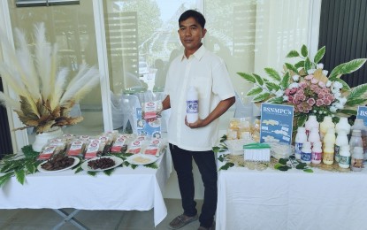 <p><strong>LEADER</strong>. Bantog Samahang Nayon Multi-Purpose Cooperative chairman Rolly Mateo Sr. shows their products during the first Kalabaw Food Festival in Asingan, Pangasinan from April 19 to 21,2024. The group will showcase its products at the International Food Exhibition Philippines 2024 at the World Trade Center in Pasay City from May 10 to 12, along with nine other exhibitors from Pangasinan. <em>(Photo by Hilda Austria)</em></p>