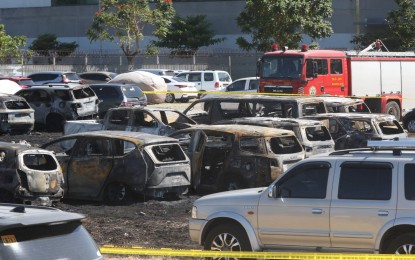 <p><strong>CHARRED.</strong> Around 19 vehicles caught fire at the parking area of the Ninoy Aquino International Airport Terminal 3 in Pasay City on Monday (April 22, 2024). No one was hurt in the incident. <em>(PNA photo by Avito Dalan)</em></p>