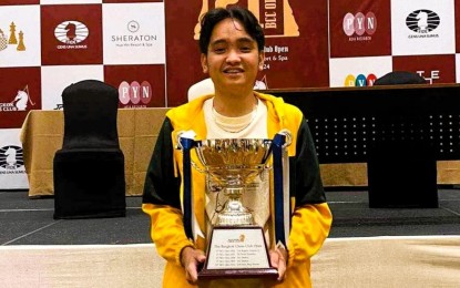 <p><strong>CHAMP. </strong>National Master Lorenzo Aaron Cantela holds the champion's trophy during the awarding ceremony of the 21st Bangkok Chess Club Challenger at the Sheraton Hua Hin Resort & Spa in Thailand on Sunday (April 21, 2024). His current Elo ratings are 1915 (standard), 1885 (rapid) and 1804 (blitz). <em>(Contributed photo) </em></p>
