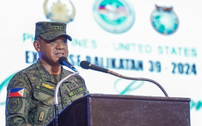 <p><strong>BALIKATAN 2024. </strong>AFP chief Gen. Romeo Brawner Jr. speaks at the opening rites of the Balikatan 2024 in Camp Aguinaldo, Quezon City on Monday (April 22, 2024). A total of 11,000 American soldiers and 5,000 Filipinos are taking part in the 39th edition of the drills. <em>(Photo courtesy of AFP)</em></p>