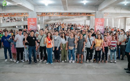 <p><strong>GOV'T AID.</strong> Students from Camalig, Albay pose for a photo opportunity with Senator Imee Marcos (in orange top) during the distribution of financial assistance from the Department of Social Welfare and Development's (DSWD) Assistance to Individuals in Crisis Situation (AICS) program on Saturday (April 20, 2024). Each qualified beneficiary received PHP3,000. <em>(Photo courtesy of Camalig LGU)</em></p>