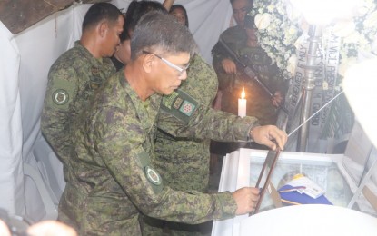 <p><strong>SACRIFICE.</strong> Brig. Gen. Noel Vestuir, commander of the Army's 802nd Infantry Brigade awards a medal to a soldier who died while saving two children from drowning in Borongan City, Eastern Samar. He was honored for his unselfish act of sacrificing his life to save the children. <em>(Photo courtesy of Philippine Army)</em></p>