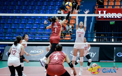 <p><strong>WINNER. </strong>University of Perpetual Help's Mary Rhose Dapol (No. 1) tries to score against San Beda University's Jayde Margaret Dela Cruz in the NCAA Season 99 women’s volleyball tournament at the Filoil EcoOil Arena in San Juan on Tuesday (April 23, 2024). The Lady Altas won, 20-25, 25-13, 22-25, 25-17, 15-6. <em>(NCAA photo) </em></p>