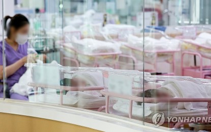<p><strong>POSTNATAL CARE.</strong> A nurse takes care of a baby at a postnatal care center in a hospital in Seoul in this file photo taken on Feb. 28, 2024. Recent data showed another decline in childbirths among Koreans. <em>(Yonhap)</em></p>